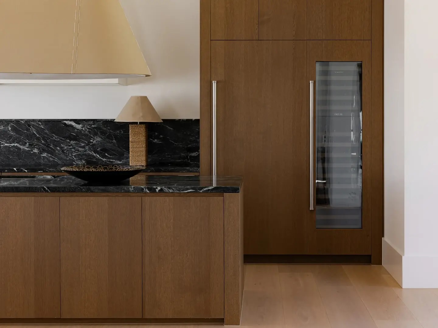 Red Hill home kitchen with Bayonne veneer cabinetry and joinery complemented by matching timber flooring.